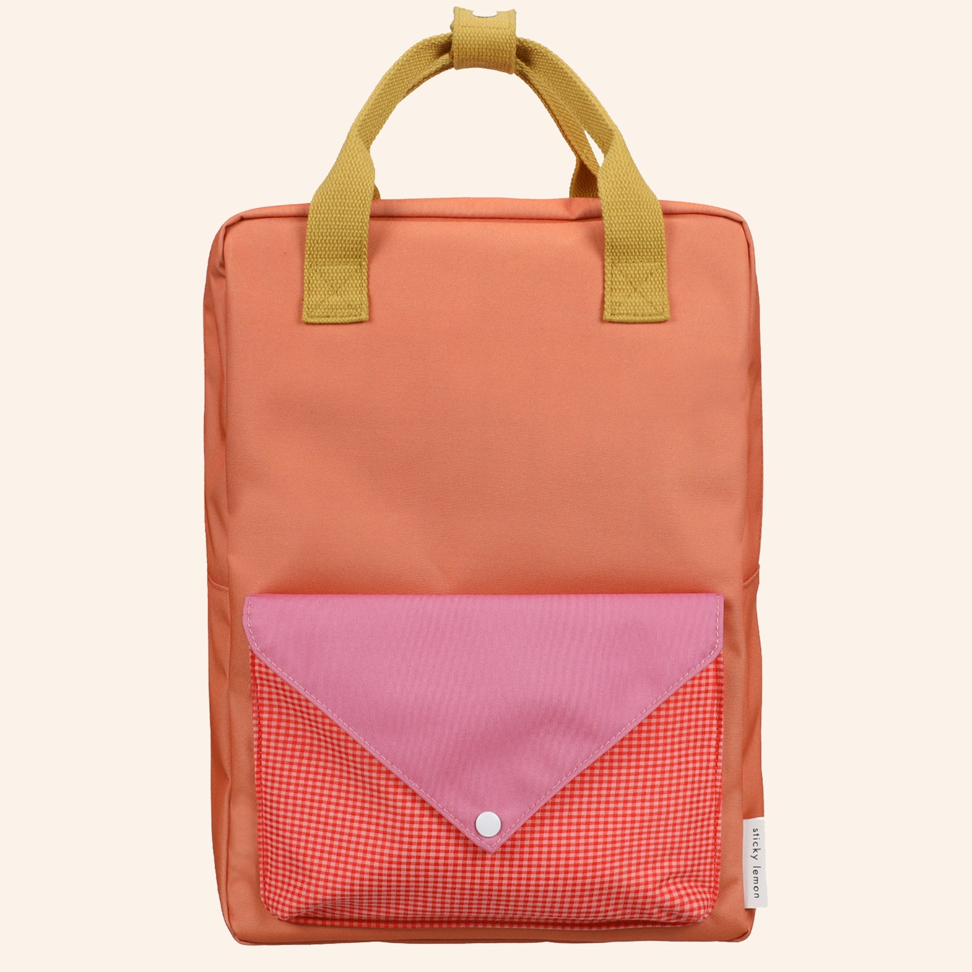 Grote Sticky Lemon rugzak met envelope voorvak met een mix van roze, rode, oranje en gele kleuren.
